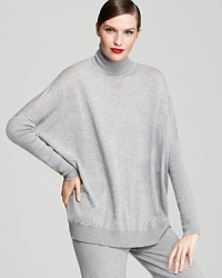 Style this easy, oversized Donna Karan New York turtleneck over slim jeans and tall boots for the weekend, or pair it with coordinating cashmere trousers to double the luxury.