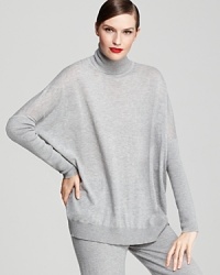 Style this easy, oversized Donna Karan New York turtleneck over slim jeans and tall boots for the weekend, or pair it with coordinating cashmere trousers to double the luxury. Style this easy, oversized Donna Karan New York turtleneck over slim jeans and tall boots for the weekend, or pair it with coordinating cashmere trousers to double the luxury.