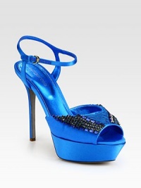 Party-perfect satin silhouette has a delicate ankle strap, substantial platform and glamorous rhinestone embellishments. Self-covered heel, 5 (125mm)Covered platform, 1 (25mm)Compares to a 4 heel (100mm)Embellished satin upperLeather lining and solePadded insoleMade in ItalyOUR FIT MODEL RECOMMENDS ordering one size up as this style runs small. 