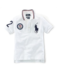 A preppy short-sleeved polo shirt in breathable cotton mesh is accented with London embroidery and a US Olympic Team embroidered emblem, celebrating Team USA's participation in the 2012 Olympics. A preppy short-sleeved polo shirt in breathable cotton mesh is accented with London embroidery and a US Olympic Team embroidered emblem, celebrating Team USA's participation in the 2012 Olympics.