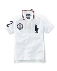 A preppy short-sleeved polo shirt in breathable cotton mesh is accented with London embroidery and a US Olympic Team embroidered emblem, celebrating Team USA's participation in the 2012 Olympics.