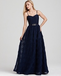 Make a grand entrance with Adrianna Papell's ruffled and rosette covered gown, dramatic in a deep navy hue. Make a grand entrance with Adrianna Papell's ruffled and rosette covered gown, dramatic in a deep navy hue.