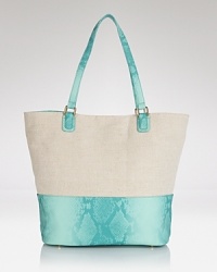 Contrast PVC accents this minimalist canvas Cornelia Guest tote, which is secured by a magnetic snap and has a lined interior with multiple pockets. Contrast PVC accents this minimalist canvas Cornelia Guest tote, which is secured by a magnetic snap and has a lined interior with multiple pockets.