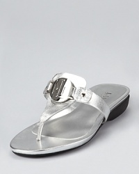 A monogrammed badge showcases Lauren Ralph Lauren's recognizable initials on these gleaming metallic sandals, equipped with a low, practical wedge. A monogrammed badge showcases Lauren Ralph Lauren's recognizable initials on these gleaming metallic sandals, equipped with a low, practical wedge.