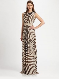 This fluid, floor-length design gets its exotic edge from a bold animal print.Jewel necklineSleevelessGathered bodice and skirtContrast banded waist Concealed back zipFully linedAbout 54 longViscoseDry cleanMade in Italy of imported fabricModel shown is 5'10 (177cm) wearing US size Small. This fluid, floor-length design gets its exotic edge from a bold animal print.Jewel necklineSleevelessGathered bodice and skirtContrast banded waist Concealed back zipFully linedAbout 54 longViscoseDry cleanMade in Italy of imported fabricModel shown is 5'10 (177cm) wearing US size Small.