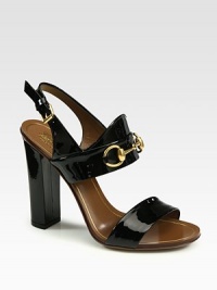 Patent leather high-heel sandal with Gucci horsebit loafer 60th anniversary detail. Self-covered heel, 4 (100mm)Patent leather upperAdjustable slingback strapLeather lining and solePadded insoleMade in Italy Patent leather high-heel sandal with Gucci horsebit loafer 60th anniversary detail. Self-covered heel, 4 (100mm)Patent leather upperAdjustable slingback strapLeather lining and solePadded insoleMade in Italy