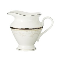 Brocade achieves an understated elegance by a combination of three design elements: a richly textured pattern of acanthus leaves; the neutral versatility of taupe; and a dramatic black band with Greek key detailing in platinum. Brocade achieves an understated elegance by a combination of three design elements: a richly textured pattern of acanthus leaves; the neutral versatility of taupe; and a dramatic black band with Greek key detailing in platinum.