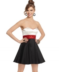 Strike the right note in this awesome A-line dress by Trixxi. It's got a strapless sweetheart neckline with contrasting piping, a beaded and sequined waistband and a full, flared skirt as the finishing touch. Strike the right note in this awesome A-line dress by Trixxi. It's got a strapless sweetheart neckline with contrasting piping, a beaded and sequined waistband and a full, flared skirt as the finishing touch.