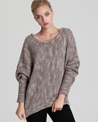 Surround yourself with luxury. This Rebecca Minkoff oversized sweater boasts a rich melange knit, bringing a cozy elegance to your weekend look. Surround yourself with luxury. This Rebecca Minkoff oversized sweater boasts a rich melange knit, bringing a cozy elegance to your weekend look.