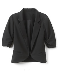 A menswear-inspired blazer with three-quarter shirred sleeves for a sophisticated look. A menswear-inspired blazer with three-quarter shirred sleeves for a sophisticated look.