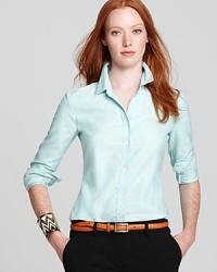 A solid essential for year-round style, this Theory top was designed for those who favor a button down that doesn't feel buttoned-up. A solid essential for year-round style, this Theory top was designed for those who favor a button down that doesn't feel buttoned-up.