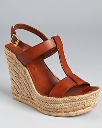 Back to basics--rich, luxe leather and a raffia wedge add classic touches to a timeless espadrille sandal with high standards. From Delman. Back to basics--rich, luxe leather and a raffia wedge add classic touches to a timeless espadrille sandal with high standards. From Delman.
