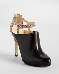 Step out in Enzo Angiolini's Yoursonly, a sleek shoe that's best described as sandal meets bootie. Natural-hued snakeskin embossed leather details the ankle and heel. Step out in Enzo Angiolini's Yoursonly, a sleek shoe that's best described as sandal meets bootie. Natural-hued snakeskin embossed leather details the ankle and heel.