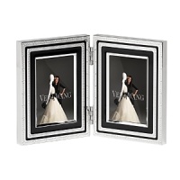 This new collection from bridal favorite Vera Wang updates the designer's popular With Love collection in striking black enamel and silver. Featuring a geometric design, it is at once Art Deco-inspired and thoroughly modern. This new collection from bridal favorite Vera Wang updates the designer's popular With Love collection in striking black enamel and silver. Featuring a geometric design, it is at once Art Deco-inspired and thoroughly modern.