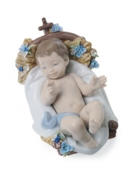 A true bundle of joy, this baby Jesus figurine snuggles up to a powder-blue blanket in a basket that's decorated with blooms and entirely handcrafted in premium Lladro porcelain. A true bundle of joy, this baby Jesus figurine snuggles up to a powder-blue blanket in a basket that's decorated with blooms and entirely handcrafted in premium Lladro porcelain.