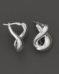 With a languid twist, a foldover hoop earring in polished 14 Kt. white gold. With a languid twist, a foldover hoop earring in polished 14 Kt. white gold.