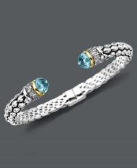Cuff love. Pretty round-cut blue topaz (7 ct .t.w.) and sparkling diamonds (1/10 ct. t.w.) adorn the ends of this stunning open-cuff bracelet. Set in sterling silver with 14k gold accents. Approximate length: 7 inches. Cuff love. Pretty round-cut blue topaz (7 ct .t.w.) and sparkling diamonds (1/10 ct. t.w.) adorn the ends of this stunning open-cuff bracelet. Set in sterling silver with 14k gold accents. Approximate length: 7 inches.