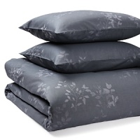 With a delicate pattern of leaves and small berries on a navy ground, this Calvin Klein duvet set exudes peaceful elegance. The duvet and sham pair perfectly with hyacinth hue sheets and accent pillows for sweet dreams. With a delicate pattern of leaves and small berries on a navy ground, this Calvin Klein duvet set exudes peaceful elegance. The duvet and sham pair perfectly with hyacinth hue sheets and accent pillows for sweet dreams.