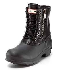These Hunter boots combine a rugged leather upper with a sleek waterproof sole for seasonal perfection. The side zip closure lets you suit up with ease. These Hunter boots combine a rugged leather upper with a sleek waterproof sole for seasonal perfection. The side zip closure lets you suit up with ease.