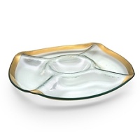 Ancient Italian relics are translated into an abstracted modern design in this handcrafted dinnerware and serving collection from designer Ann Morhauser. This handpainted, 24 karat gold collection tastefully accentuates everything from sleek, modern designs to delicate porcelain, or can be used on its own as a dramatic statement.