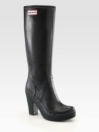 Knee-high rainy weather essential sweetened by an unexpected heel and platform. Rubber heel, 4 (100mm)Rubber platform, 1 (25mm)Compares to a 3 heel (75mm)Shaft, 14Leg circumference, 14Rubber upperPull-on styleJersey liningRubber solePadded insoleImported Knee-high rainy weather essential sweetened by an unexpected heel and platform. Rubber heel, 4 (100mm)Rubber platform, 1 (25mm)Compares to a 3 heel (75mm)Shaft, 14Leg circumference, 14Rubber upperPull-on styleJersey liningRubber solePadded insoleImported