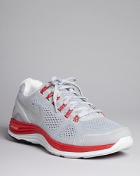 These sporty sneakers feature an accelerated high-energy design with bright color accents and sci-fi inspired ribbing at the outer sole. From Nike, classic and contemporary with an unwavering focus on athletic performance. These sporty sneakers feature an accelerated high-energy design with bright color accents and sci-fi inspired ribbing at the outer sole. From Nike, classic and contemporary with an unwavering focus on athletic performance.