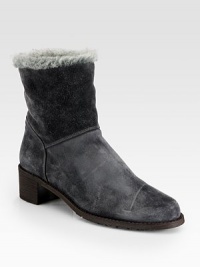 This versatile suede design with faux fur trim and lining can be folded over for a short silhouette. Stacked heel, 1¾ (45mm)Suede upper with faux fur trimPull-on styleFaux fur liningRubber solePadded insoleImported This versatile suede design with faux fur trim and lining can be folded over for a short silhouette. Stacked heel, 1¾ (45mm)Suede upper with faux fur trimPull-on styleFaux fur liningRubber solePadded insoleImported
