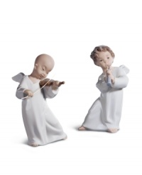 Take note. With the sweet face and wings of an angel in beautifully glazed porcelain, this flute-toting Lladro figurine makes any home sing. Shown right. Take note. With the sweet face and wings of an angel in beautifully glazed porcelain, this flute-toting Lladro figurine makes any home sing. Shown right.