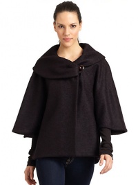 THE LOOKDramatic portrait collar with button closureThree-quarter length cape sleevesButton closures at sidesTHE FITAbout 27 from shoulder to hemTHE MATERIALFleece wool/nylonFully linedCARE & ORIGINDry cleanMade in ItalyModel shown is 5'9 (175cm) wearing US size 4. 
