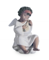 End your day on a high note, in the presence of this beautiful angel. Handcrafted in Lladro porcelain, she makes any heart sing. End your day on a high note, in the presence of this beautiful angel. Handcrafted in Lladro porcelain, she makes any heart sing.