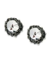 Metallic sparkle takes charge on these stud earrings from Swarovski. A clear crystal is surrounded by Crystal Silvernight chatons. Crafted in rhodium-plated mixed metal. Approximate diameter: 1/2 inch. Metallic sparkle takes charge on these stud earrings from Swarovski. A clear crystal is surrounded by Crystal Silvernight chatons. Crafted in rhodium-plated mixed metal. Approximate diameter: 1/2 inch.