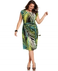 A bold botanical print beautifies Spense's cap sleeve plus size dress, featuring a faux wrap design. A bold botanical print beautifies Spense's cap sleeve plus size dress, featuring a faux wrap design.
