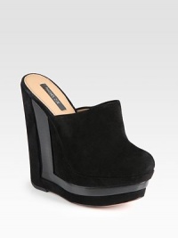 Soft suede design with wooden inserts and an architectural wedge and platform. Stacked suede and wooden wedge, 5¾ (145mm)Stacked platform, 1¾ (45mm)Compares to a 4 heel (100mm)Suede upperLeather lining and solePadded insoleImportedOUR FIT MODEL RECOMMENDS ordering one half size up as this style runs small. Soft suede design with wooden inserts and an architectural wedge and platform. Stacked suede and wooden wedge, 5¾ (145mm)Stacked platform, 1¾ (45mm)Compares to a 4 heel (100mm)Suede upperLeather lining and solePadded insoleImportedOUR FIT MODEL RECOMMENDS ordering one half size up as this style runs small.