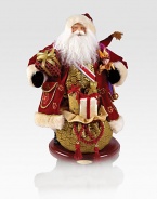 Festive keepsake that will last season after season, resting atop a sturdy wooden stand. Wood and fabric18 tallHandmade and hand-paintedImported