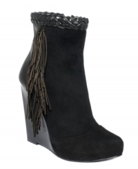 Indulge in the sexiest accents. Boutique 9's Cerys wedge booties feature a leather braid around the top and fringe detail on the sides. Indulge in the sexiest accents. Boutique 9's Cerys wedge booties feature a leather braid around the top and fringe detail on the sides.
