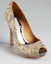 In patterned, metallic silk, Badgley Mischka's dressed up Roxie pumps showcase a luxe look. In patterned, metallic silk, Badgley Mischka's dressed up Roxie pumps showcase a luxe look.