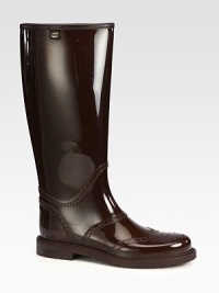 Protective rubber rain boots with cut-out accents. Self-covered heel, 1 (25mm)Shaft, 14Leg circumference, 15¼Rubber upperLeather liningRubber solePadded insoleMade in Italy Protective rubber rain boots with cut-out accents. Self-covered heel, 1 (25mm)Shaft, 14Leg circumference, 15¼Rubber upperLeather liningRubber solePadded insoleMade in Italy