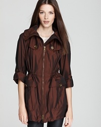 Glistening with a metallic finish, this Burberry Brit anorak melds luxe appeal with the laidback style of utilitarian outerwear. Chic copper-tone accents punctuate the glossy silhouette for a statement finish. Glistening with a metallic finish, this Burberry Brit anorak melds luxe appeal with the laidback style of utilitarian outerwear. Chic copper-tone accents punctuate the glossy silhouette for a statement finish.