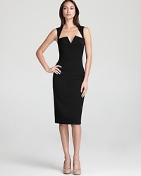 A split square neck and open back lend allure to Black Halo's little black dress, utterly timeless yet refreshingly modern. A split square neck and open back lend allure to Black Halo's little black dress, utterly timeless yet refreshingly modern.