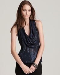 An effortless draped neck contrasts gilded sequins on this Anne Klein New York top for a standout evening look.