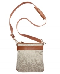 This signature Calvin Klein crossbody has a casual downtown vibe, great for the weekend. An easy top zip closure and classic leather trim top off this easy going around-town style.