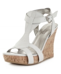 A neutral that will most certainly get noticed. The Priela sandals by GUESS feature a luxe leather silhouette atop an earthy cork wedge for leg-lengthening appeal. A neutral that will most certainly get noticed. The Priela sandals by GUESS feature a luxe leather silhouette atop an earthy cork wedge for leg-lengthening appeal.