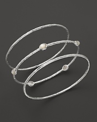 This set of three sterling silver bangles from Ippolita makes the perfect unforgettable gift. This set of three sterling silver bangles from Ippolita makes the perfect unforgettable gift.