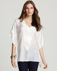 Lace, sequins and beading lavish the neckline of this Karen Kane scarf top, lending a glamorous finish to sumptuous silk. Lace, sequins and beading lavish the neckline of this Karen Kane scarf top, lending a glamorous finish to sumptuous silk.