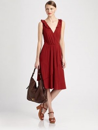 Crossover v-neck and asymmetrical overlays add a wrap effect to this supremely soft, ruffle-trimmed jersey dress. Ruffled crossover v-neckSleevelessFront-to-back asymmetrical overlaysAbout 27 from natural waistCottonDry cleanImportedModel shown is 5'10 (177cm) wearing US size Small. Crossover v-neck and asymmetrical overlays add a wrap effect to this supremely soft, ruffle-trimmed jersey dress. Ruffled crossover v-neckSleevelessFront-to-back asymmetrical overlaysAbout 27 from natural waistCottonDry cleanImportedModel shown is 5'10 (177cm) wearing US size Small.