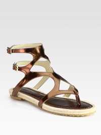 Precious metallic leather gladiator with skinny, adjustable ankle straps and a barely-there espadrille platform. Metallic leather upperLeather liningRubber solePadded insoleMade in SpainOUR FIT MODEL RECOMMENDS ordering one half size up as this style runs small. 