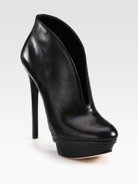 A deep vamp modernizes this leather platform ankle boot with glossy patent trim. Self-covered heel, 5½ (140mm)Covered island platform with patent leather trim, 1¾ (45mm)Compares to a 3¾ heel (95mm)Leather upperPull-on styleLeather liningLeather and patent leather solePadded insoleImported A deep vamp modernizes this leather platform ankle boot with glossy patent trim. Self-covered heel, 5½ (140mm)Covered island platform with patent leather trim, 1¾ (45mm)Compares to a 3¾ heel (95mm)Leather upperPull-on styleLeather liningLeather and patent leather solePadded insoleImported