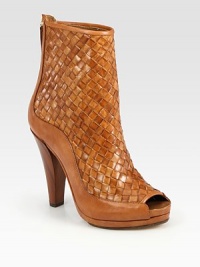 Rich, wondrously woven leather style with a stacked heel, back zipper and peep toe. Wooden heel, 4½ (115mm)Covered platform, 1 (25mm)Compares to a 3½ heel (90mm)Woven leather upperBack zipperLeather lining and solePadded insoleMade in Italy Rich, wondrously woven leather style with a stacked heel, back zipper and peep toe. Wooden heel, 4½ (115mm)Covered platform, 1 (25mm)Compares to a 3½ heel (90mm)Woven leather upperBack zipperLeather lining and solePadded insoleMade in Italy