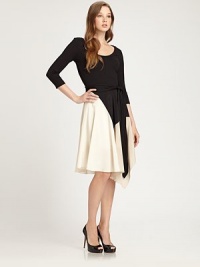 Nothing says inspired like colorblocking. This design features a solid jersey top and stretch silk skirt with a must-have this season: bold colorblocking.ScoopneckThree-quarter sleevesSelf-tie beltAsymmetrical hemFully linedAbout 40 from shoulder to hemTop: 95% viscose/5% rayon; skirt: 92% silk/8% spandexDry cleanImported Model shown is 5'9½ (176cm) wearing US size Small. OUR FIT MODEL RECOMMENDS ordering true size. Nothing says inspired like colorblocking. This design features a solid jersey top and stretch silk skirt with a must-have this season: bold colorblocking.ScoopneckThree-quarter sleevesSelf-tie beltAsymmetrical hemFully linedAbout 40 from shoulder to hemTop: 95% viscose/5% rayon; skirt: 92% silk/8% spandexDry cleanImported Model shown is 5'9½ (176cm) wearing US size Small. OUR FIT MODEL RECOMMENDS ordering true size.