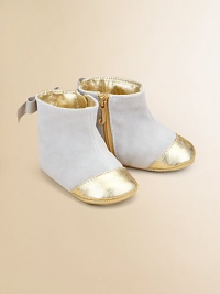 Butter-soft suede accented with a metallic cap-toe and sweet back bow.Side-zipperSuede/cotton upperCotton liningCotton soleImported Butter-soft suede accented with a metallic cap-toe and sweet back bow.Side-zipperSuede/cotton upperCotton liningCotton soleImported